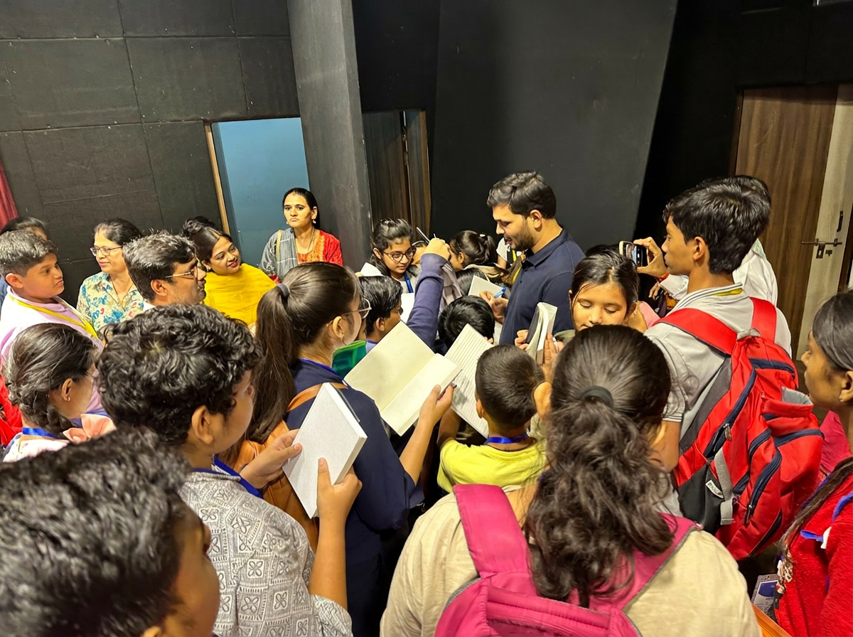 Students surrounding Sajan Shah in an intimate event moment